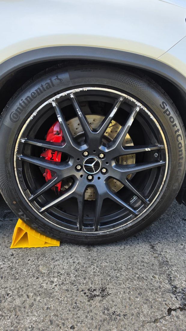 Alloy wheel with kerb rash damage before repair